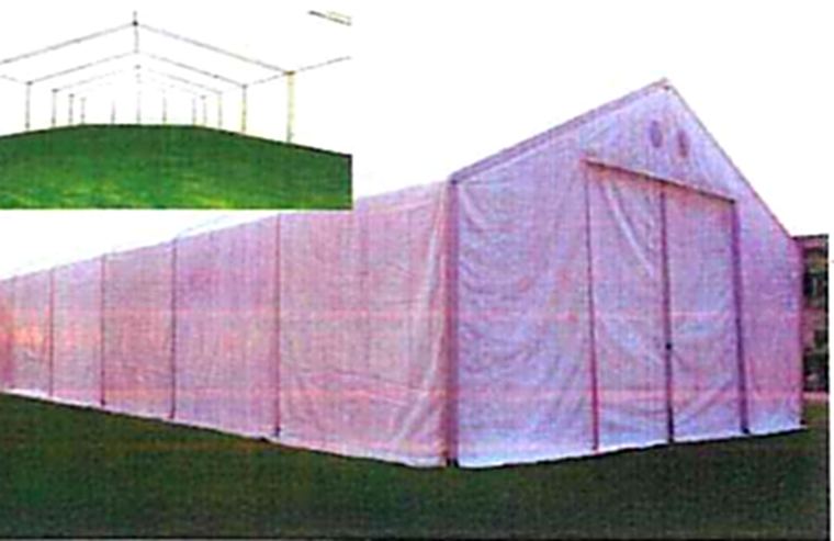 Large white relief storage hall on grass